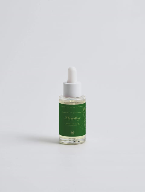 Rosemary Hair & Scalp Strengthening Oil bottle with premium packaging featuring rosemary and peppermint oils